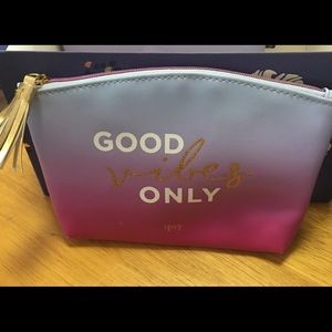 Beauty bag w/ at least 4 surprise makeup samples..